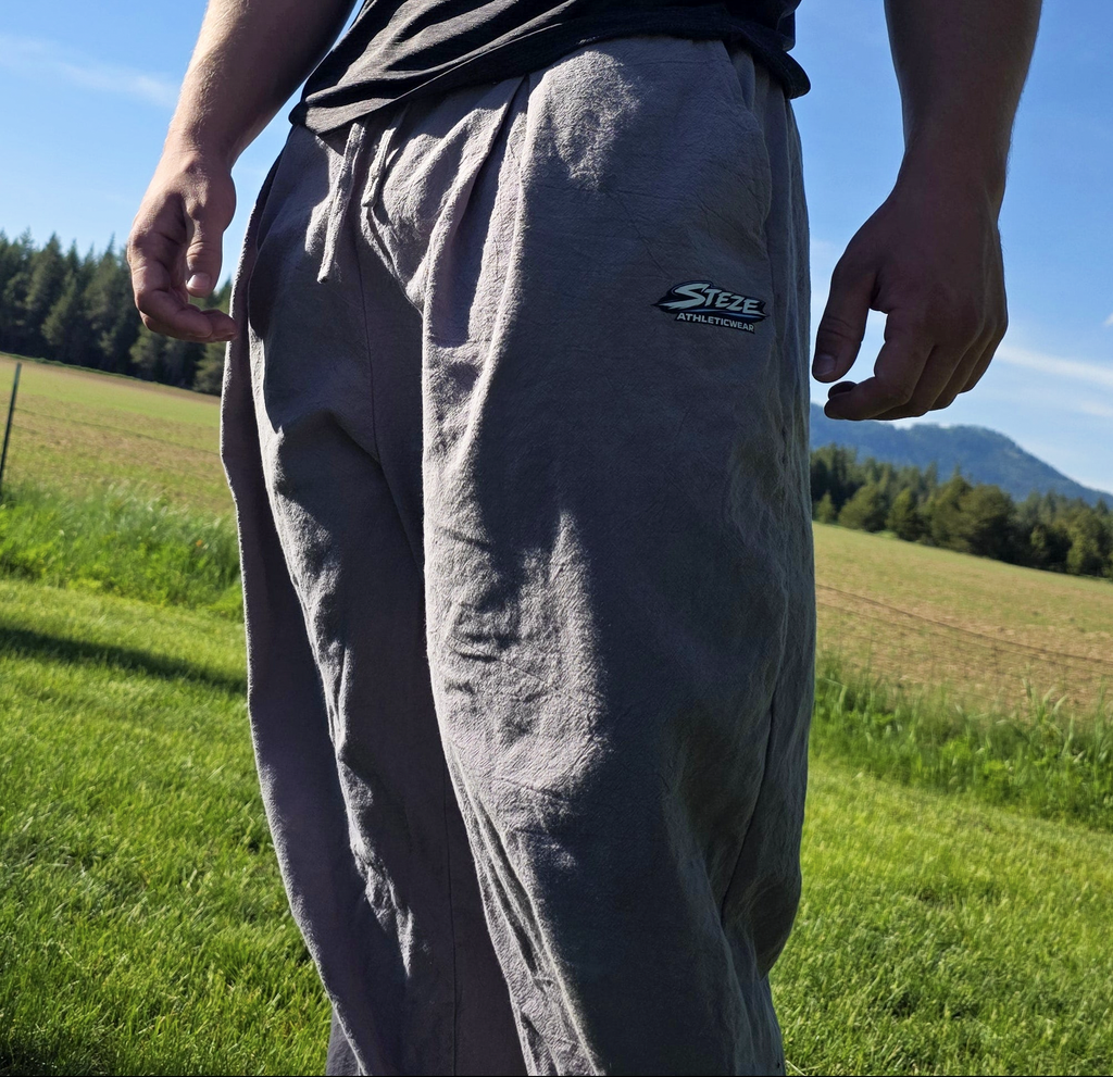 STEZE Linen Pant worn on-body, outdoor field lifestyle shot
