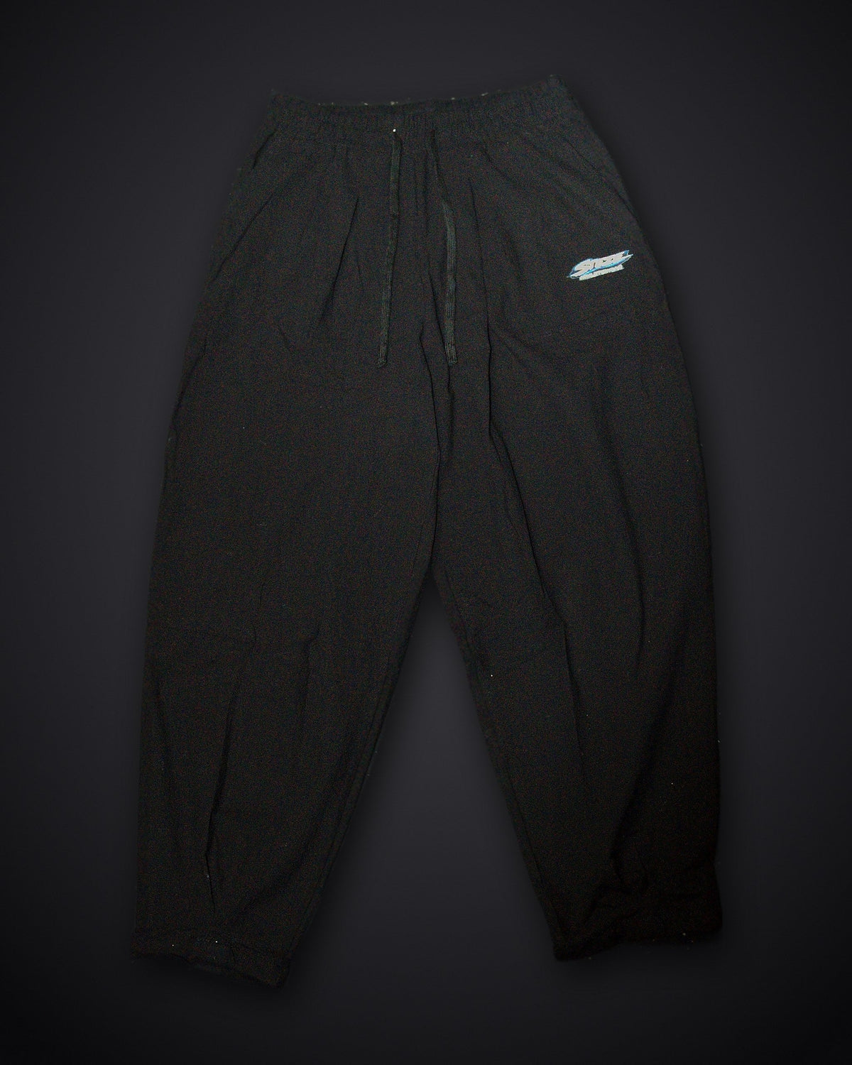 STEZE Linen Pant in black, front view on dark studio background